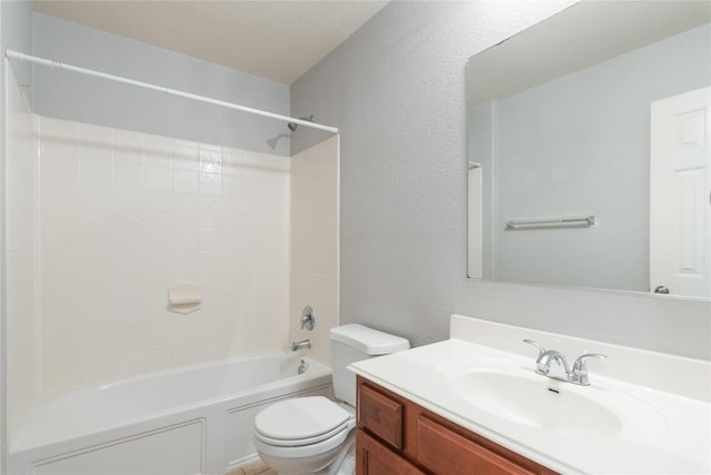 full bathroom with toilet, vanity,  shower combination, and a textured wall