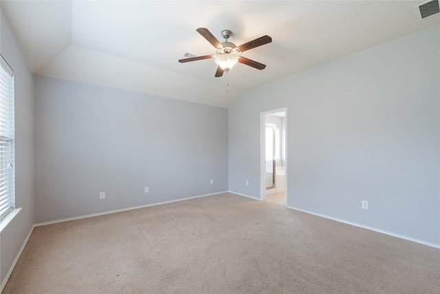 174 Barn Owl Loop, Leander, TX 78641 - empty room with light colored carpet, ceiling fan, baseboards, and vaulted ceiling