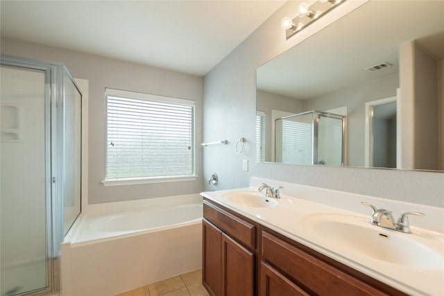 full bath featuring a shower stall, a garden tub, double vanity, and tile patterned floors