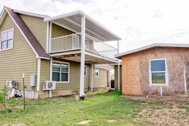 163 Buckeye, Seguin, TX 78155 - back of property featuring a balcony, ac unit, a lawn, and roof with shingles