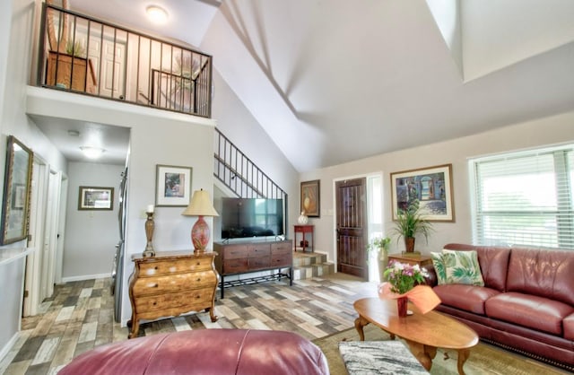 163 Buckeye, Seguin, TX 78155 - living area featuring light wood-style flooring, high vaulted ceiling, and baseboards
