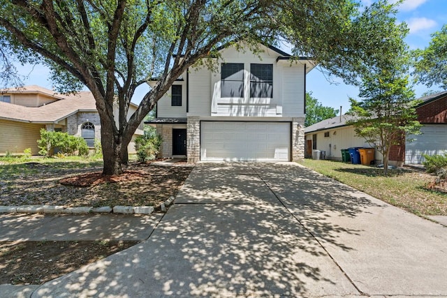 9216 Vigen Cir, Austin, TX 78748 - traditional-style house with stone siding, a garage, and driveway