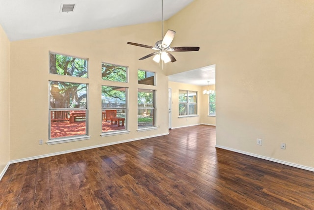 9216 Vigen Cir, Austin, TX 78748 - unfurnished room featuring ceiling fan, dark wood finished floors, vaulted ceiling, a chandelier, and baseboards