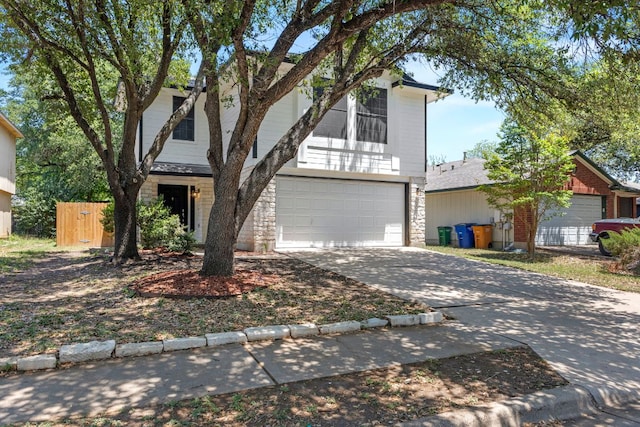 9216 Vigen Cir, Austin, TX 78748 - traditional-style home featuring a garage, concrete driveway, and stone siding