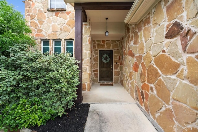 8058 Arezzo Dr, Round Rock, TX 78665 - view of exterior entry featuring stone siding