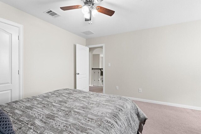 8058 Arezzo Dr, Round Rock, TX 78665 - bedroom featuring carpet, ceiling fan, and arched walkways