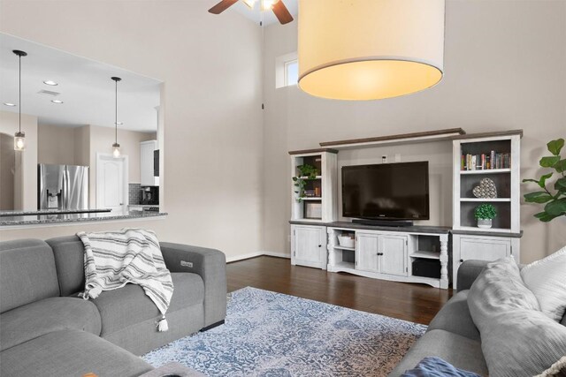8058 Arezzo Dr, Round Rock, TX 78665 - living area featuring a towering ceiling, dark wood-style flooring, ceiling fan, and recessed lighting