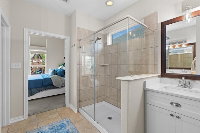8058 Arezzo Dr, Round Rock, TX 78665 - ensuite bathroom with a stall shower, tile patterned flooring, and vanity