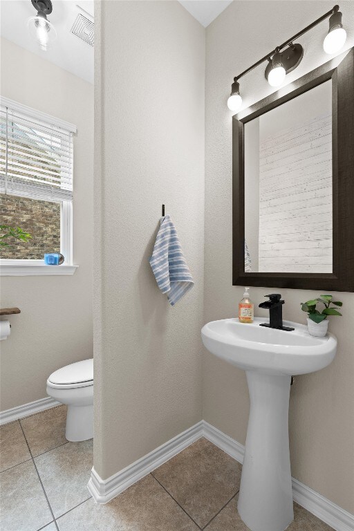 8058 Arezzo Dr, Round Rock, TX 78665 - half bath featuring tile patterned floors