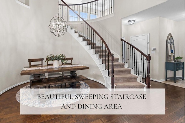 8058 Arezzo Dr, Round Rock, TX 78665 - staircase with a towering ceiling, wood finished floors, and a chandelier