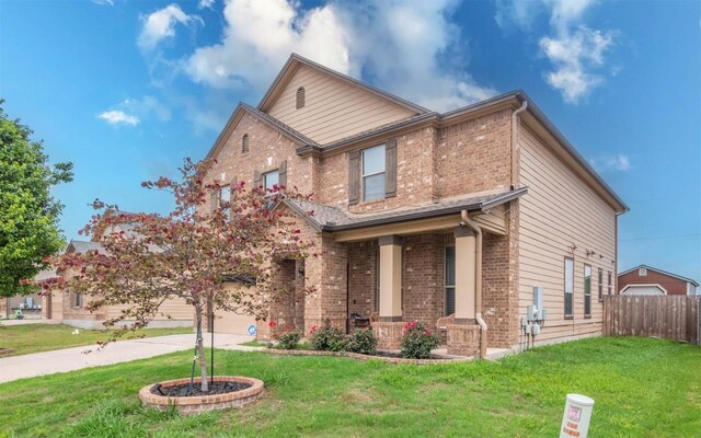 316 Carrington St, Hutto, TX 78634 - view of front facade featuring brick siding, covered porch, and driveway