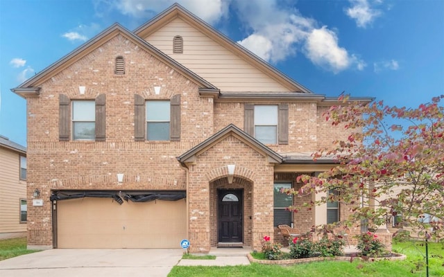 316 Carrington St, Hutto, TX 78634 - view of front of home featuring brick siding, a garage, and concrete driveway