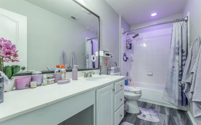 316 Carrington St, Hutto, TX 78634 - full bathroom with vanity, wood finished floors, shower / bath combo with shower curtain, and recessed lighting