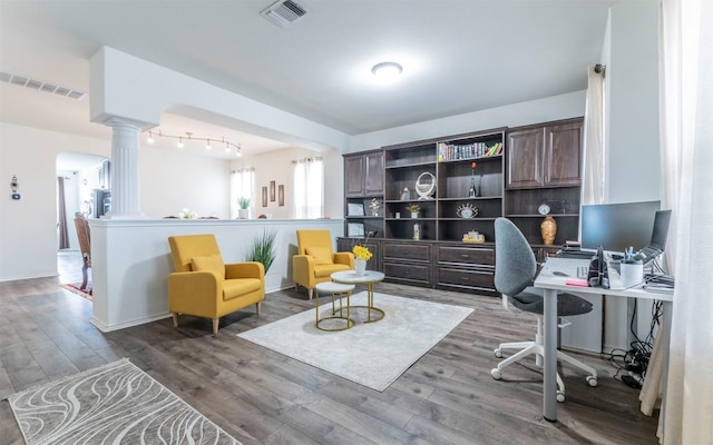 316 Carrington St, Hutto, TX 78634 - office space with ornate columns, wood finished floors, and arched walkways