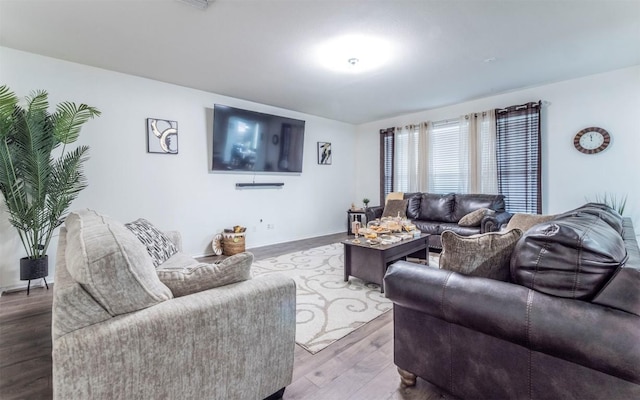 316 Carrington St, Hutto, TX 78634 - living room featuring wood finished floors and baseboards