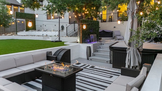 321 Cumberland Cv, Georgetown, TX 78628 - view of patio with a hot tub, an outdoor living space with a fire pit, and stairs