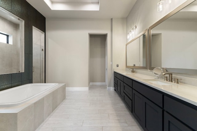 321 Cumberland Cv, Georgetown, TX 78628 - full bathroom with a garden tub, a stall shower, double vanity, and baseboards