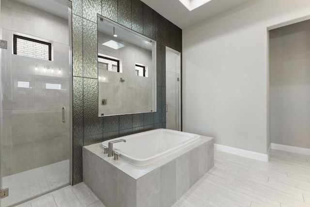 321 Cumberland Cv, Georgetown, TX 78628 - bathroom with a garden tub, a stall shower, tile patterned flooring, and plenty of natural light