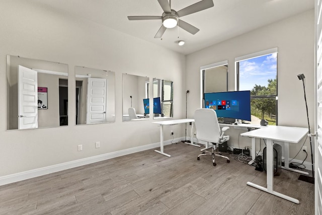 321 Cumberland Cv, Georgetown, TX 78628 - office area featuring wood finished floors, ceiling fan, and baseboards