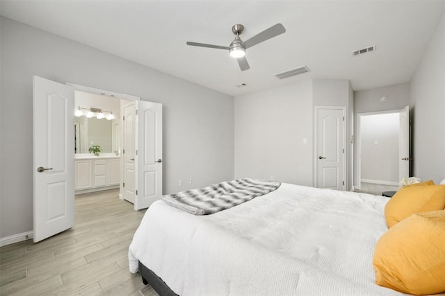 bedroom with light wood-style floors, baseboards, connected bathroom, and ceiling fan