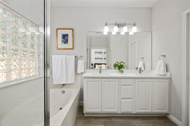 full bath with a bath, double vanity, and a shower with shower door