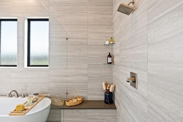 217 Northcrest Dr, Liberty Hill, TX 78642 - full bath with a freestanding tub, tile walls, and tiled shower