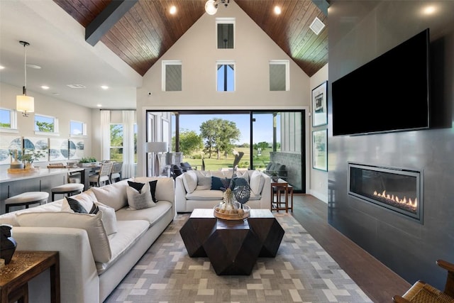 217 Northcrest Dr, Liberty Hill, TX 78642 - living room featuring wood ceiling, light wood finished floors, a fireplace, high vaulted ceiling, and recessed lighting