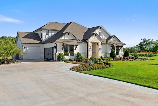 217 Northcrest Dr, Liberty Hill, TX 78642 - view of front of house with board and batten siding, driveway, stone siding, an attached garage, and a front lawn