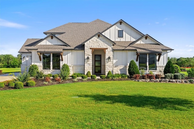 217 Northcrest Dr, Liberty Hill, TX 78642 - view of front facade with board and batten siding, stone siding, a shingled roof, and a front lawn