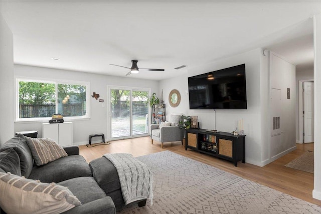 2312 Aldford Dr, Austin, TX 78745 - living room with ceiling fan, wood finished floors, and baseboards