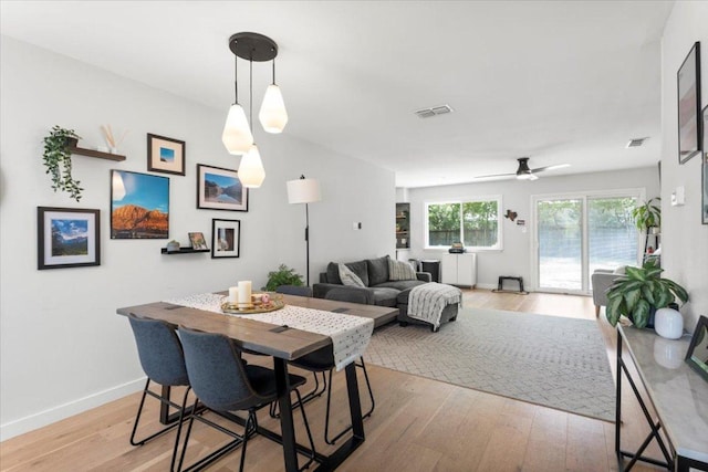 2312 Aldford Dr, Austin, TX 78745 - dining area featuring light wood finished floors, ceiling fan, and baseboards