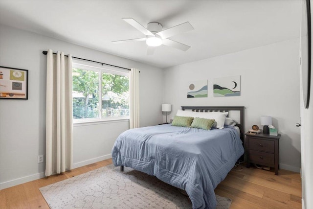 2312 Aldford Dr, Austin, TX 78745 - bedroom with wood finished floors, baseboards, and ceiling fan