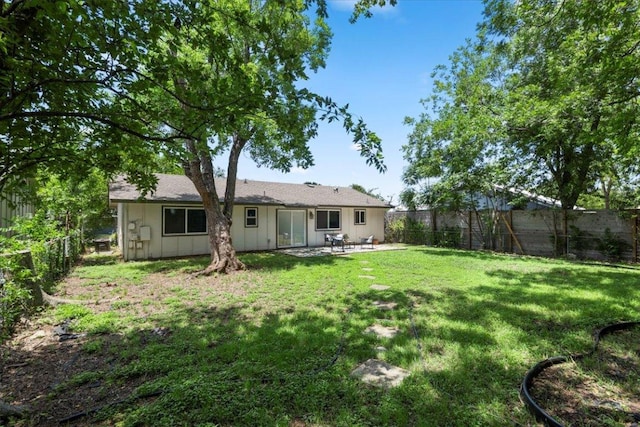2312 Aldford Dr, Austin, TX 78745 - back of house featuring a fenced backyard and a patio area