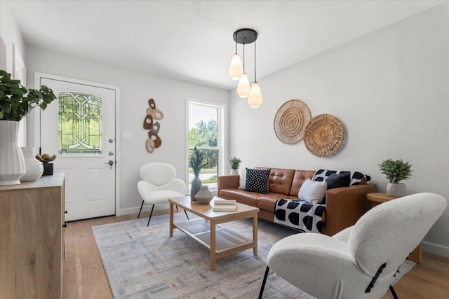 2312 Aldford Dr, Austin, TX 78745 - living room featuring light wood-style floors and baseboards