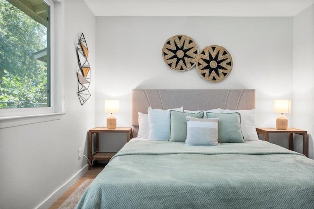 2312 Aldford Dr, Austin, TX 78745 - bedroom featuring multiple windows and wood finished floors