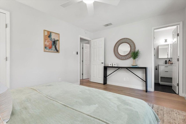2312 Aldford Dr, Austin, TX 78745 - bedroom with wood finished floors and a ceiling fan