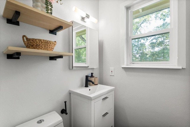 2312 Aldford Dr, Austin, TX 78745 - half bathroom featuring vanity and toilet