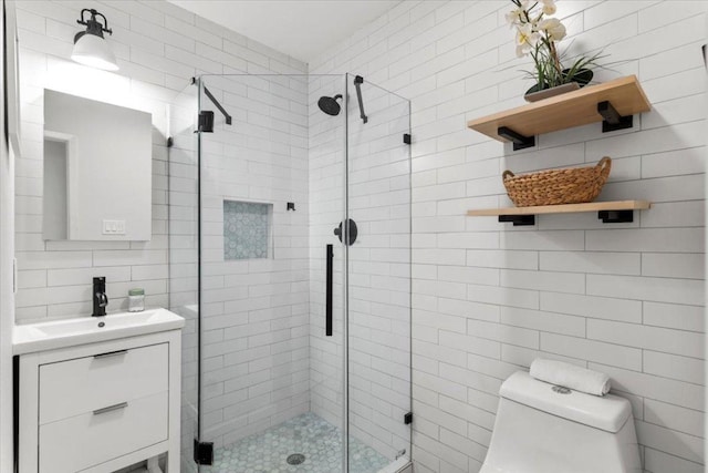 2312 Aldford Dr, Austin, TX 78745 - bathroom featuring tile walls, vanity, and a shower stall