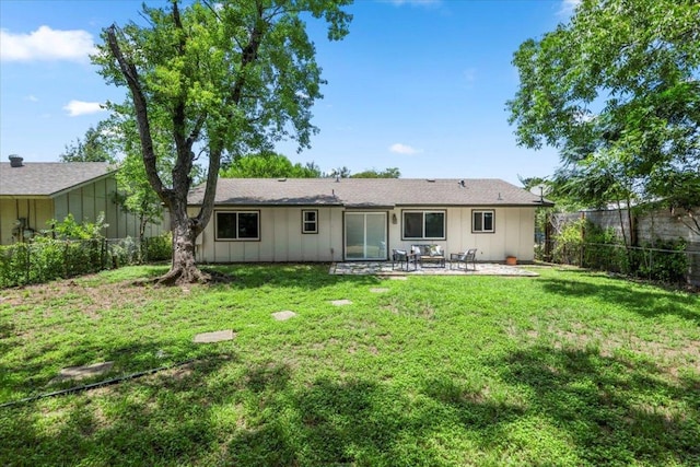 2312 Aldford Dr, Austin, TX 78745 - back of house with a patio area, a fenced backyard, and board and batten siding