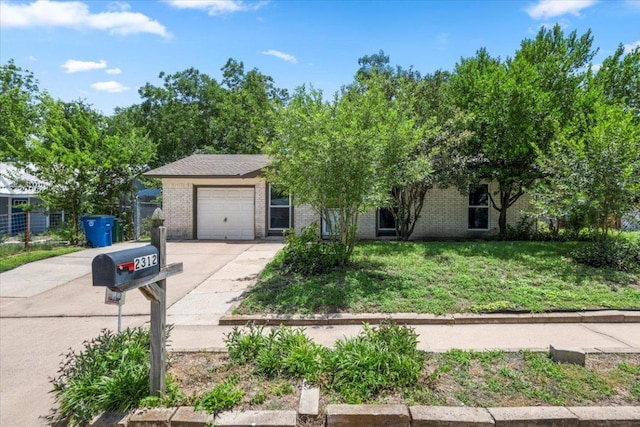 2312 Aldford Dr, Austin, TX 78745 - obstructed view of property with driveway, a garage, a front lawn, and brick siding