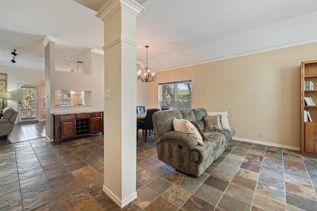 11008 Needham Ct, Austin, TX 78739 - living room featuring stone tile floors, a chandelier, crown molding, and ornate columns