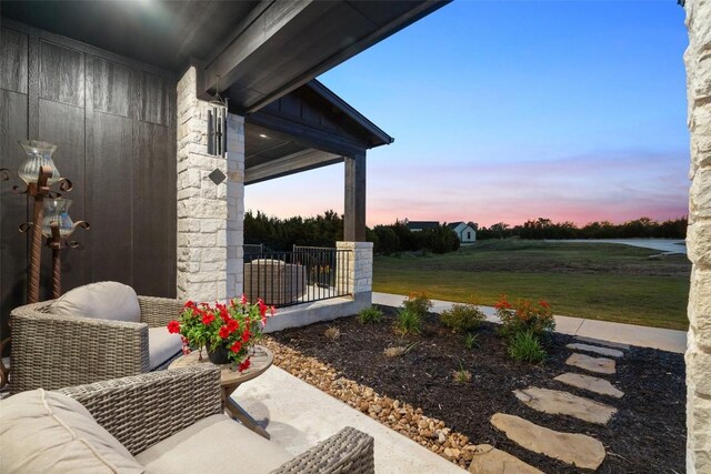 513 Red Yucca Ct, Liberty Hill, TX 78642 - yard at dusk featuring a lawn