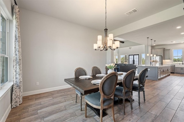 513 Red Yucca Ct, Liberty Hill, TX 78642 - dining space featuring light wood-style floors, a chandelier, baseboards, and recessed lighting