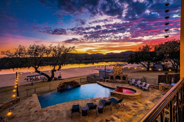 3500 River Oaks Dr, Kingsland, TX 78639 - view of pool with a patio, an outdoor fireplace, and a pool with connected hot tub