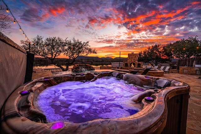 3500 River Oaks Dr, Kingsland, TX 78639 - view of pool with a hot tub, an outdoor fireplace, and a patio area