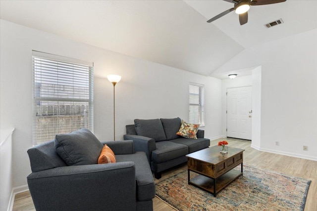21223 Byerly Turk Dr, Pflugerville, TX 78660 - living area with light wood-type flooring, a ceiling fan, vaulted ceiling, and baseboards