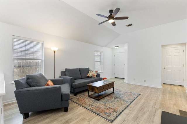21223 Byerly Turk Dr, Pflugerville, TX 78660 - living room featuring a ceiling fan, lofted ceiling, light wood-type flooring, and baseboards