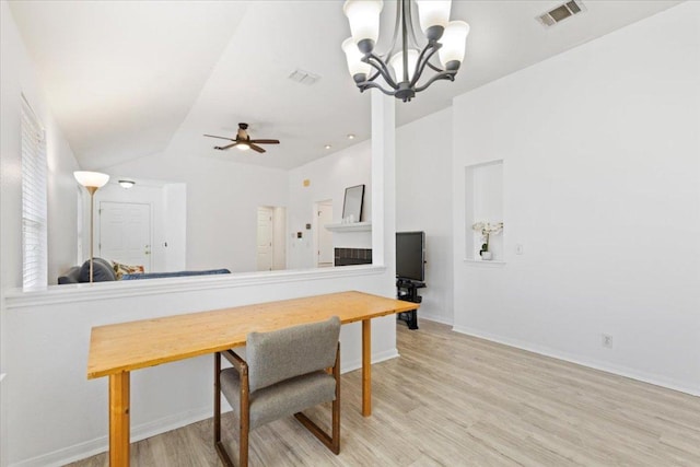 21223 Byerly Turk Dr, Pflugerville, TX 78660 - dining space featuring light wood-type flooring, a ceiling fan, a chandelier, baseboards, and lofted ceiling