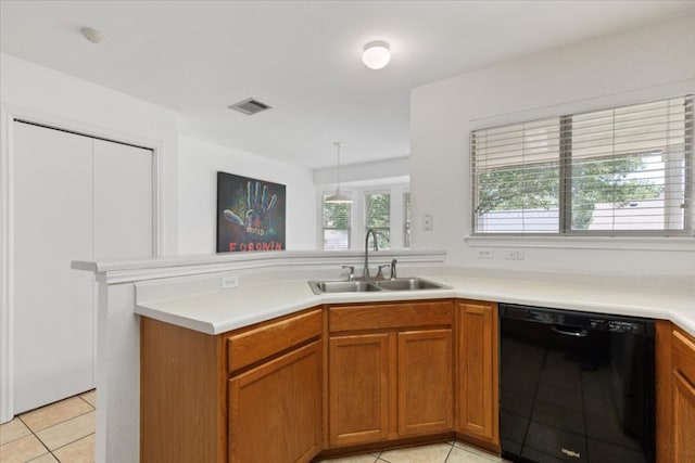 21223 Byerly Turk Dr, Pflugerville, TX 78660 - kitchen with dishwasher, a sink, a peninsula, light tile patterned floors, and light countertops