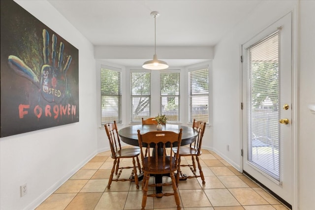 21223 Byerly Turk Dr, Pflugerville, TX 78660 - dining space with light tile patterned flooring and baseboards